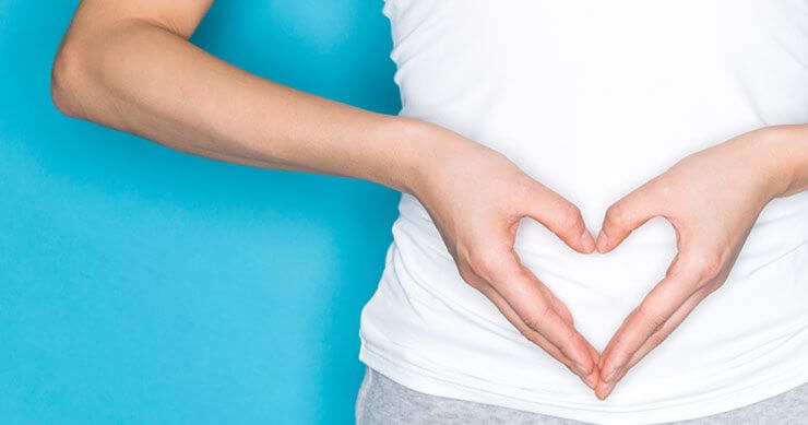 Person with hands over gut